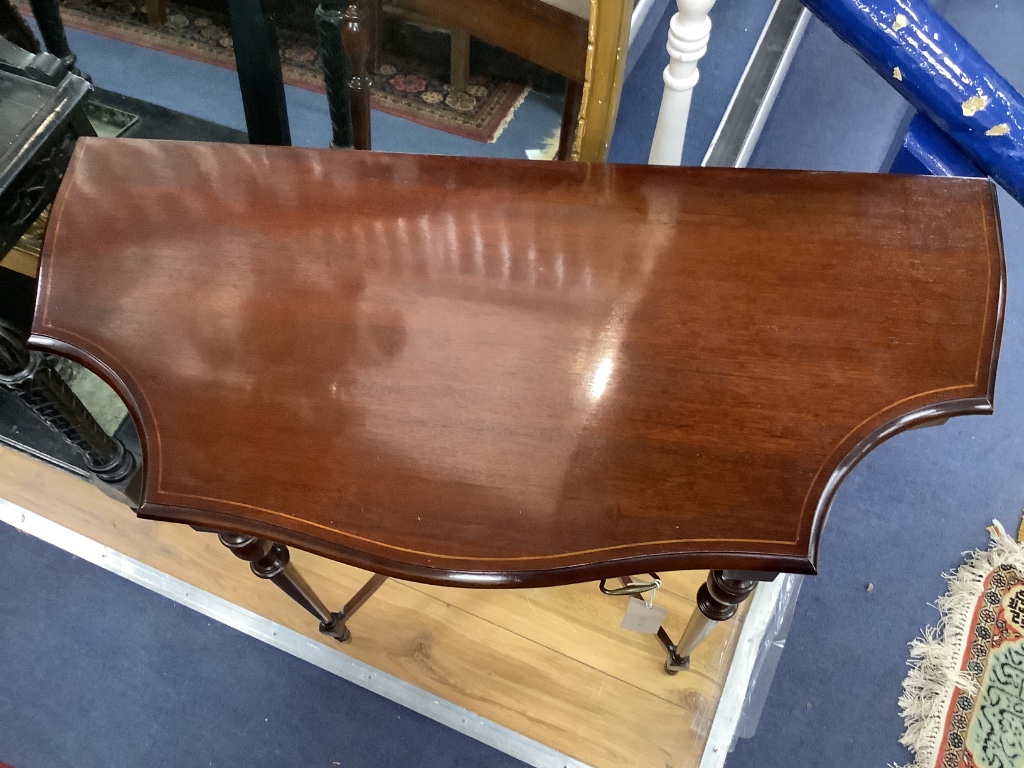 A reproduction mahogany serpentine console table, width 98cm, depth 46cm, height 73cm